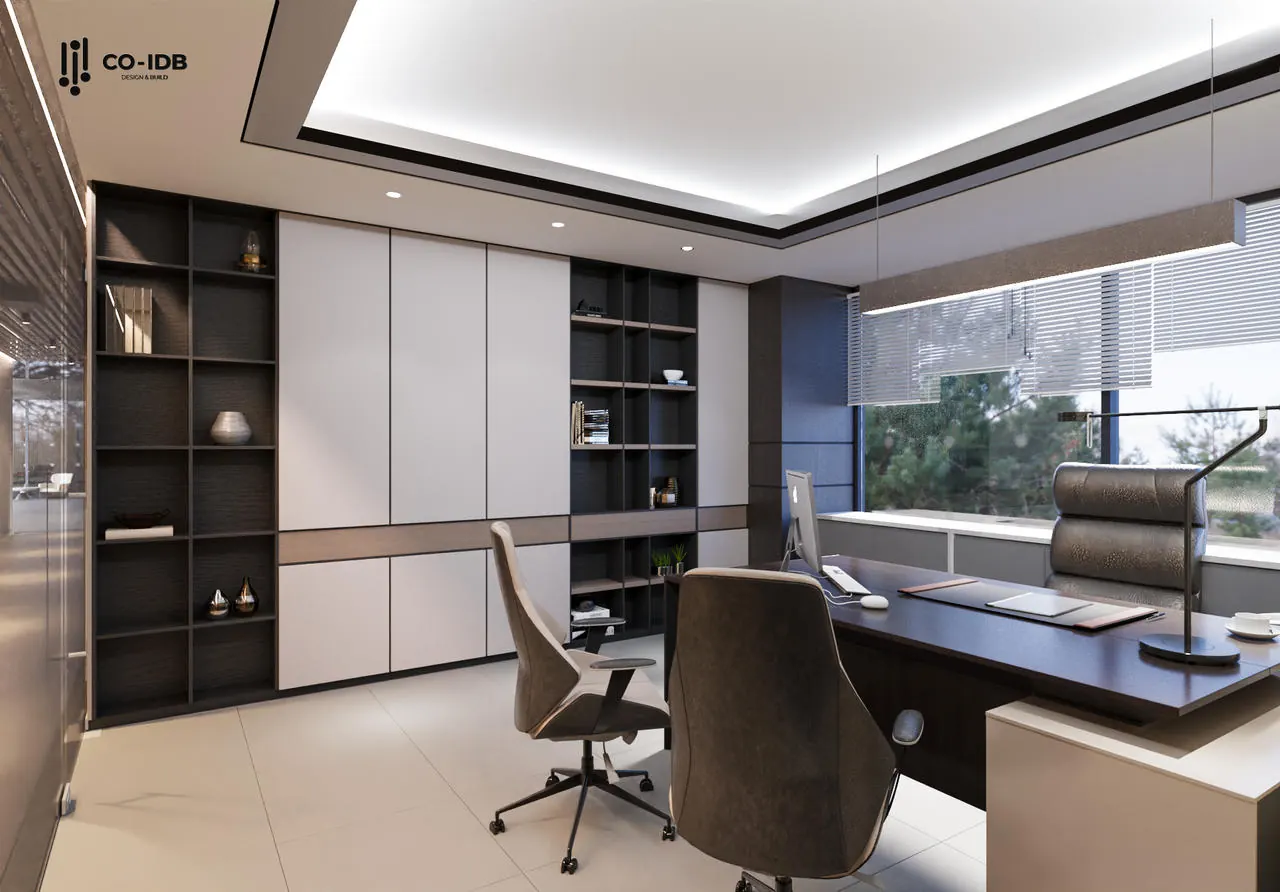 Modern private office with a desk, leather chairs, and built-in bookshelves